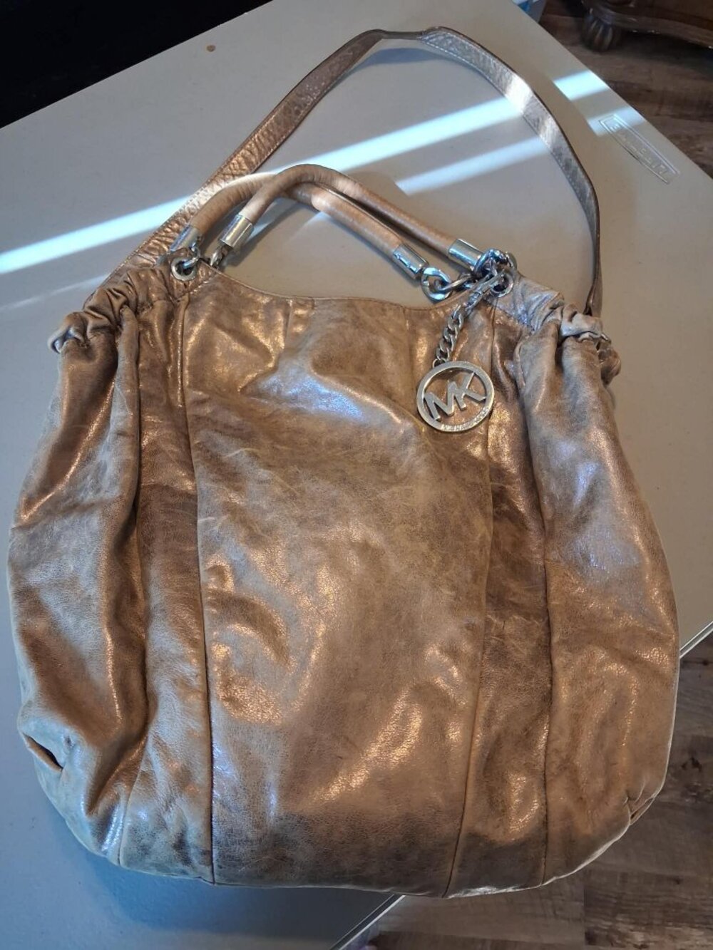 Michael Kors Champagne Gold Leather Hobo Purse MK Charm Bag
